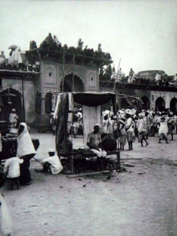 crowd on gate, crowd around mosque gate, george gaste